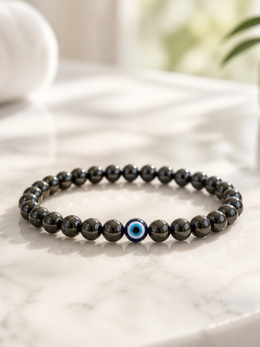 Hematite Beaded Bracelet with Blue Evil Eye Accent